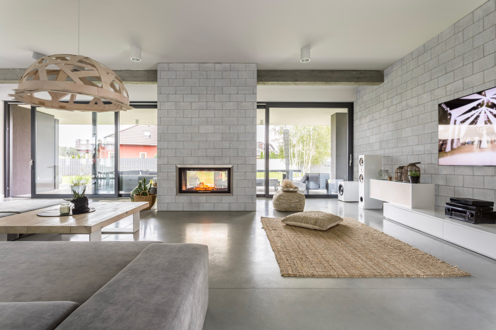 Design ideas for an urban living room in Montreal with a concrete fireplace surround.