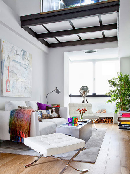 Mid-sized eclectic formal and open concept medium tone wood floor living room photo in Madrid with white walls