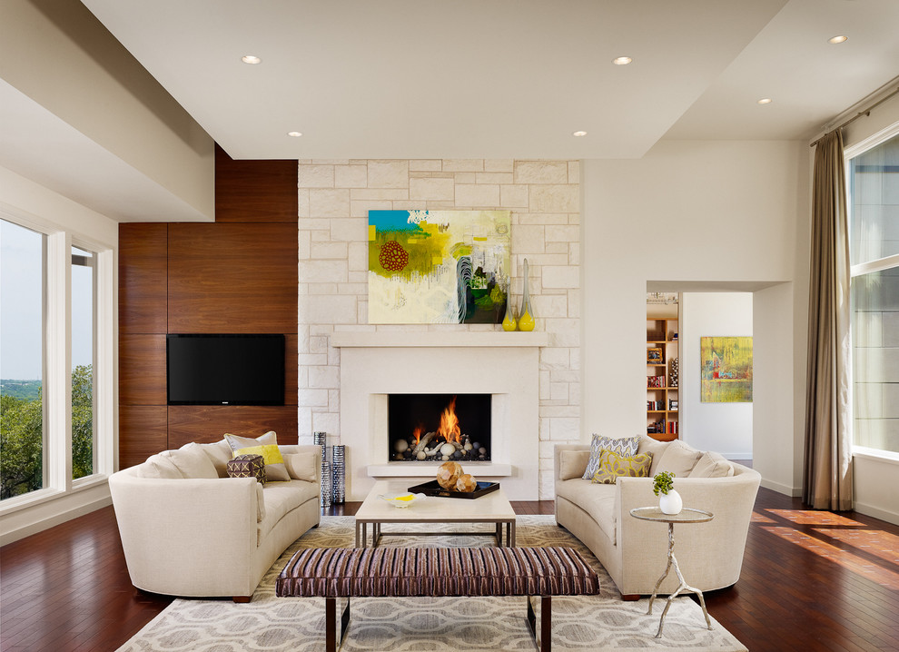 Design ideas for a large contemporary living room in Austin with a standard fireplace and a wall mounted tv.
