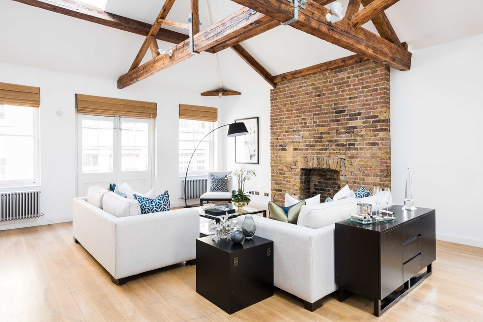 Photo of a medium sized rustic enclosed living room in London with white walls, light hardwood flooring and beige floors.