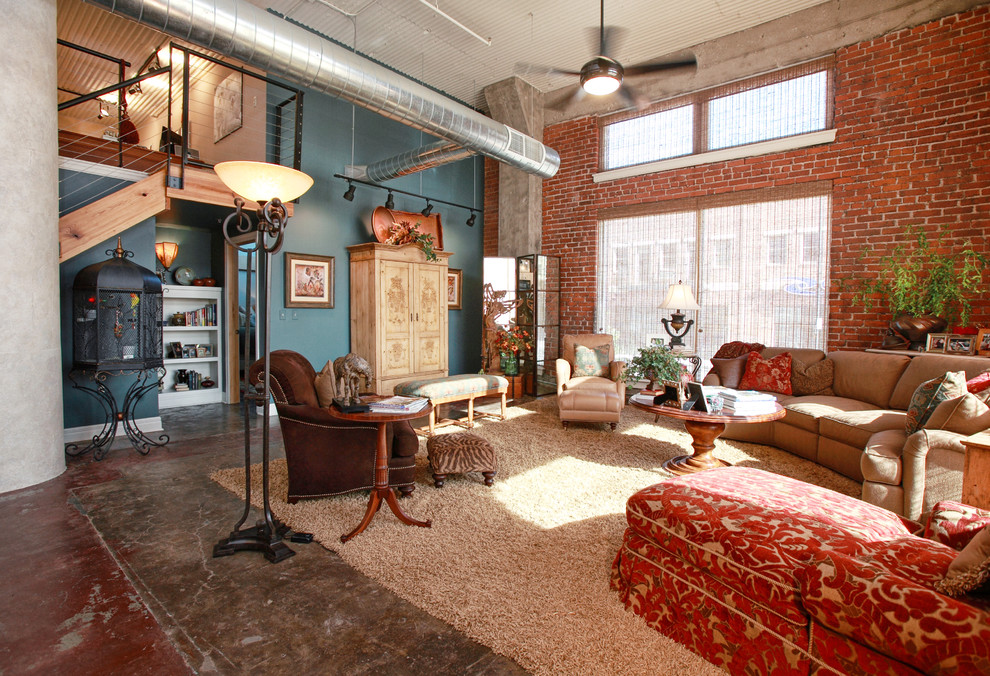 Inspiration for an eclectic living room in Wichita with concrete flooring.