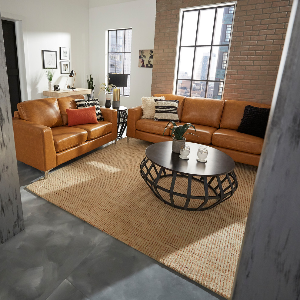 Medium sized industrial mezzanine living room in Los Angeles with a reading nook, brown walls, concrete flooring, no fireplace, no tv and grey floors.