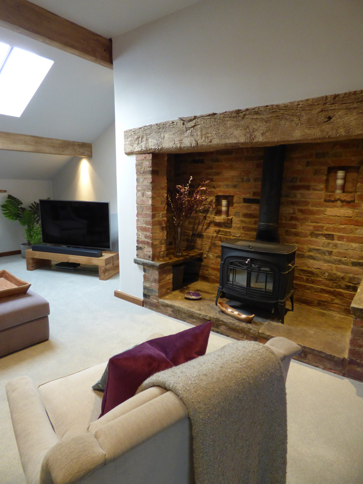 Photo of a large contemporary formal open plan living room in Kent with purple walls, carpet, a wood burning stove, a brick fireplace surround, a corner tv, grey floors and exposed beams.