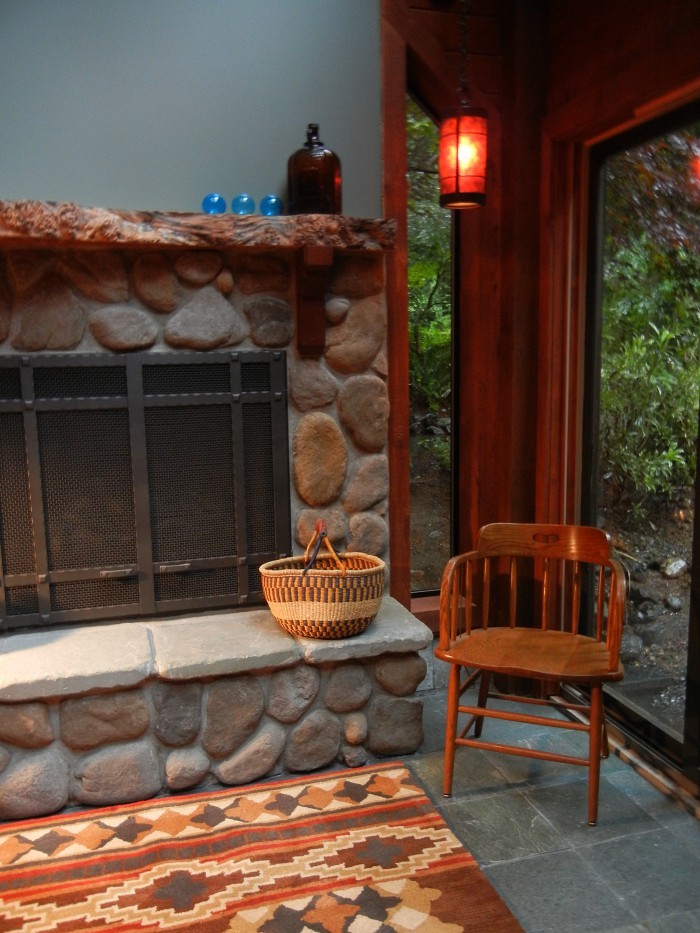 Mid-sized mountain style formal and enclosed slate floor living room photo in Seattle with a standard fireplace, a stone fireplace and blue walls