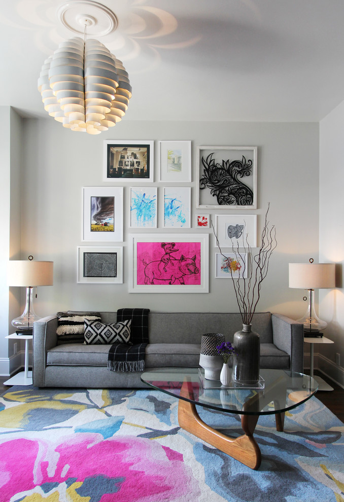 Пример оригинального дизайна: парадная, изолированная гостиная комната среднего размера:: освещение в современном стиле с серыми стенами, паркетным полом среднего тона, телевизором на стене и коричневым полом без камина
