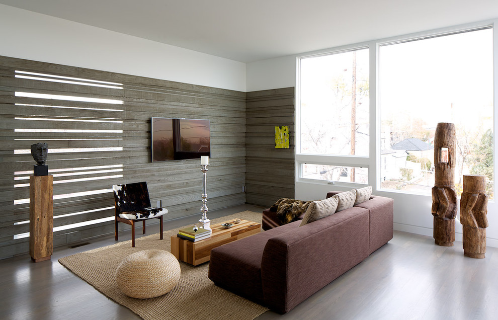 Idéer för ett modernt vardagsrum, med en väggmonterad TV