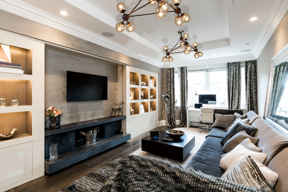 Inspiration for a mid-sized modern enclosed dark wood floor and brown floor living room remodel in Manchester with gray walls and a wall-mounted tv