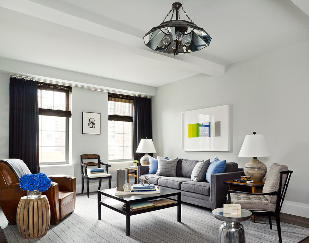 Immagine di un soggiorno minimal con sala formale e pareti grigie