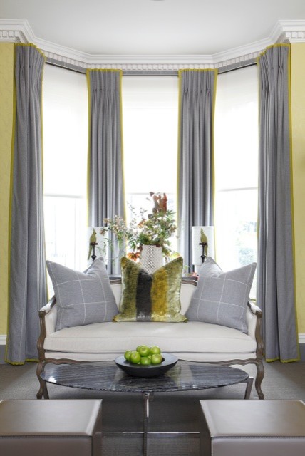 Inspiration for a medium sized eclectic formal enclosed living room in London with yellow walls, carpet, a concealed tv and grey floors.