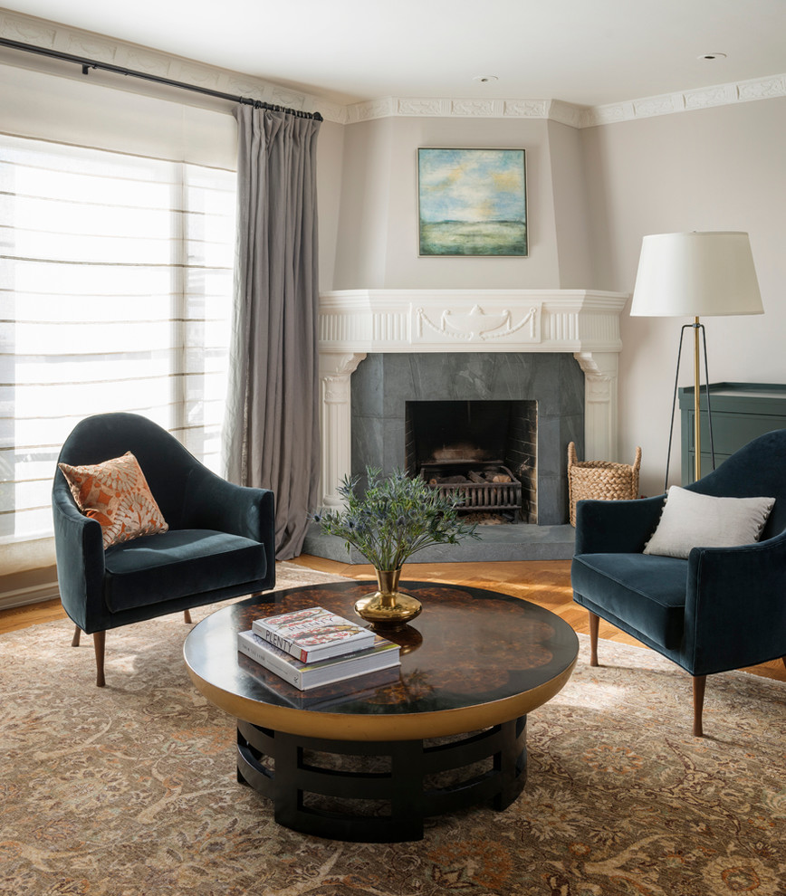Inspiration for a transitional formal and enclosed medium tone wood floor living room remodel in San Francisco with gray walls and a corner fireplace
