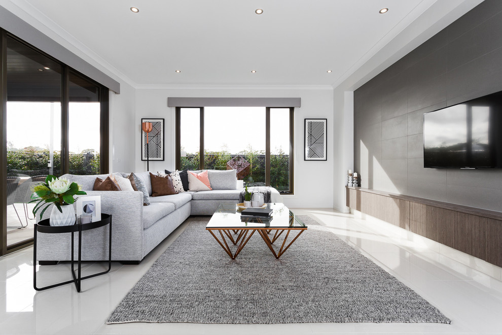 Large contemporary formal open plan living room in Melbourne with grey walls, no fireplace and a wall mounted tv.