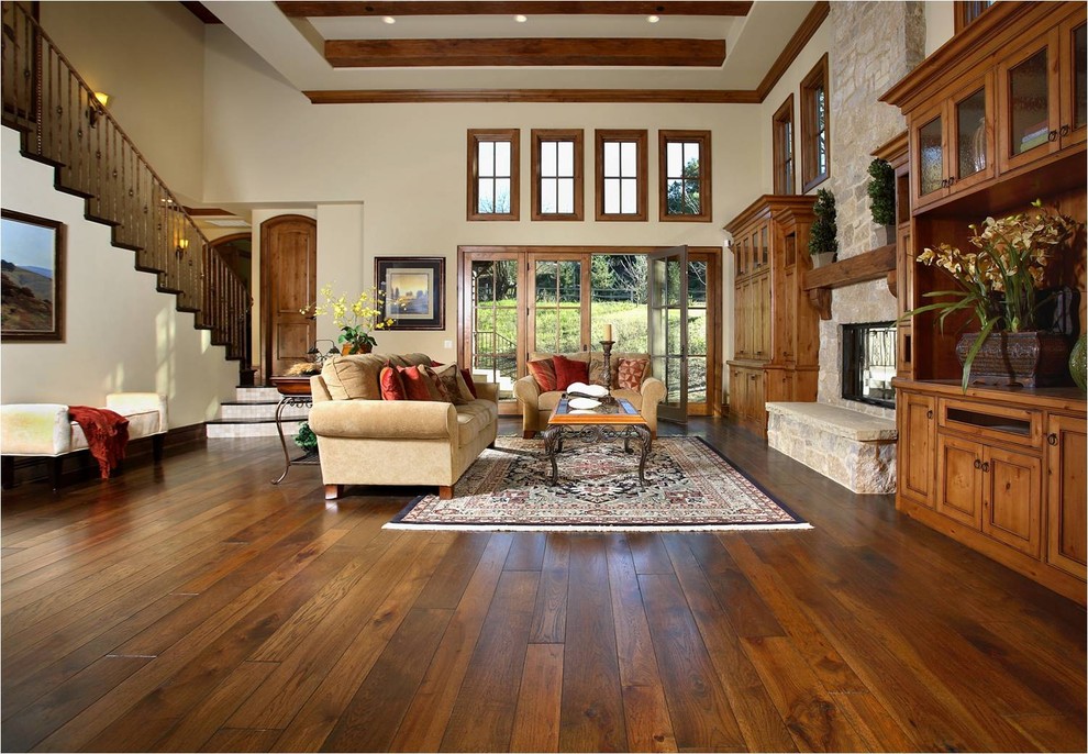 Example of a classic brown floor living room design in San Francisco with a stone fireplace