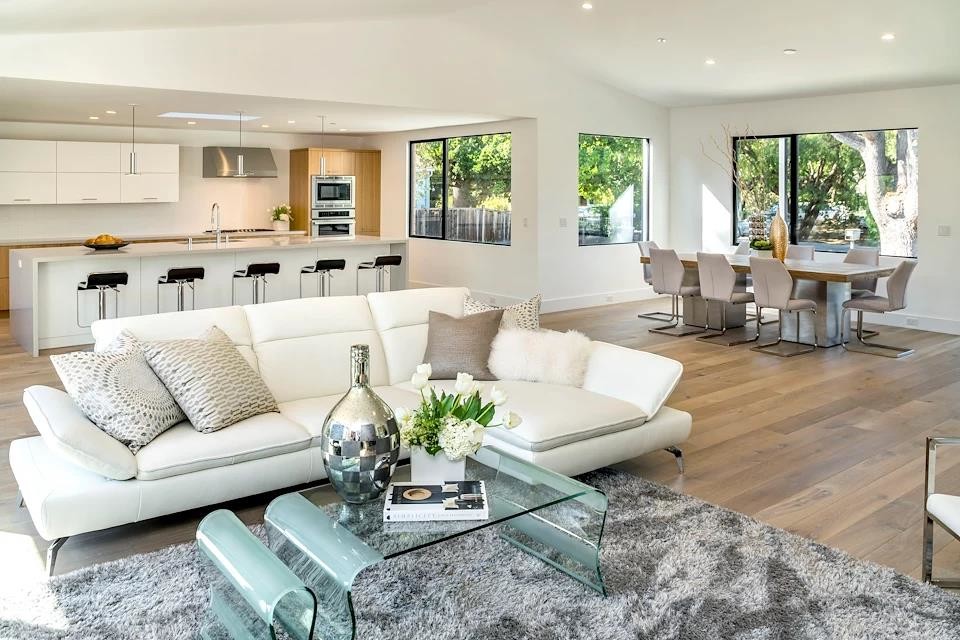 Living room - mid-sized modern formal and open concept light wood floor and beige floor living room idea in San Francisco with white walls, a ribbon fireplace, a plaster fireplace and no tv