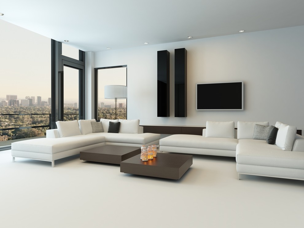 This is an example of a large modern open plan living room in Los Angeles with white walls, a wall mounted tv, white floors and feature lighting.