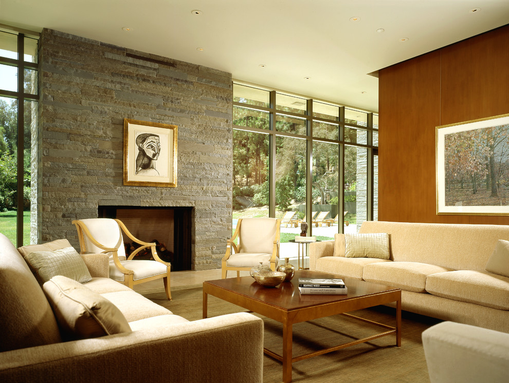 Идея дизайна: открытая, парадная гостиная комната в стиле модернизм с ковровым покрытием, фасадом камина из камня и стандартным камином без телевизора