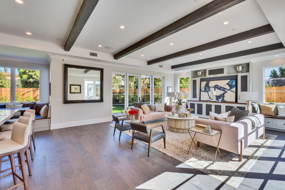 Inspiration for a traditional open plan living room in Los Angeles with beige walls, medium hardwood flooring and brown floors.