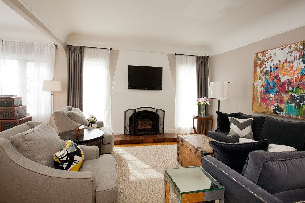 Example of a transitional living room design in Los Angeles with beige walls