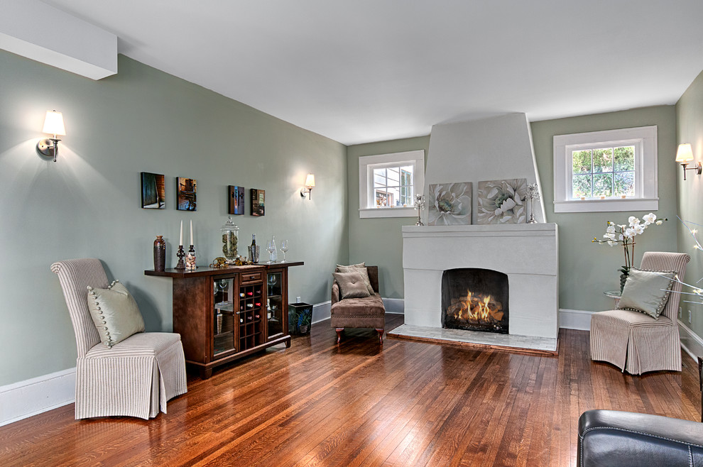 Transitional living room photo in Other with a standard fireplace and a concrete fireplace