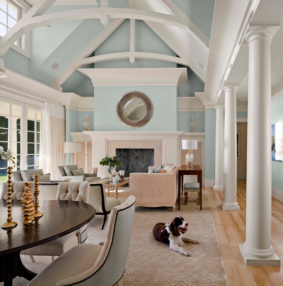 Inspiration for a large transitional formal and open concept light wood floor and beige floor living room remodel in Miami with blue walls, a standard fireplace, a tile fireplace and no tv