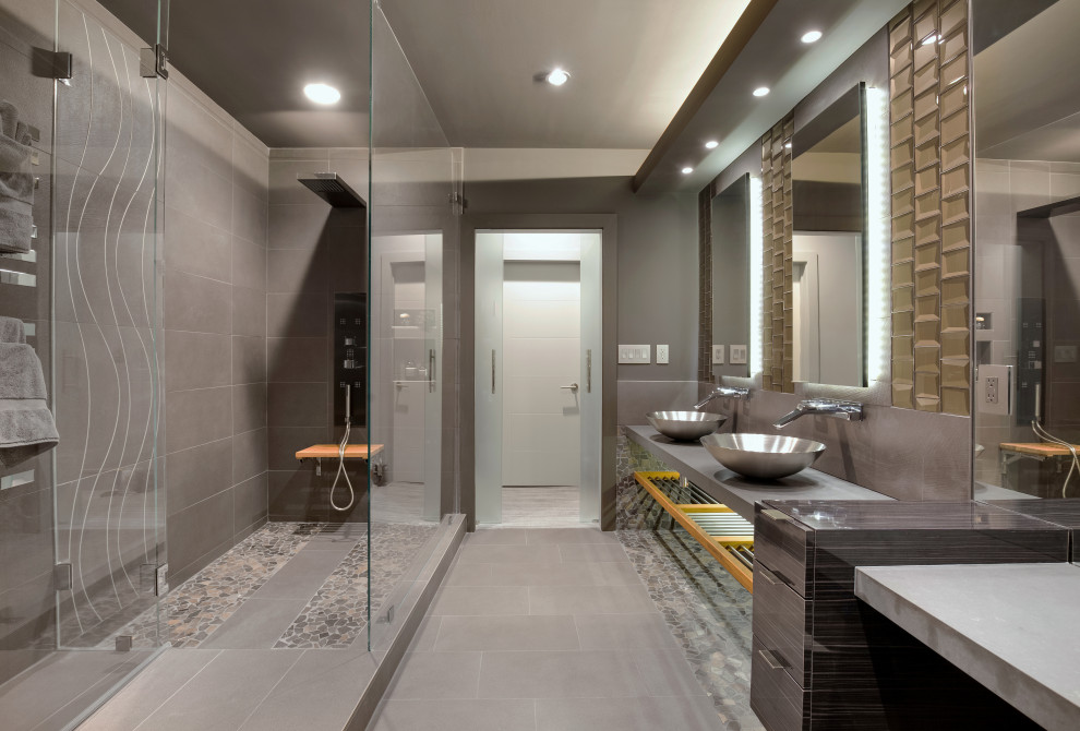Medium sized modern bathroom with grey walls, light hardwood flooring and grey floors.