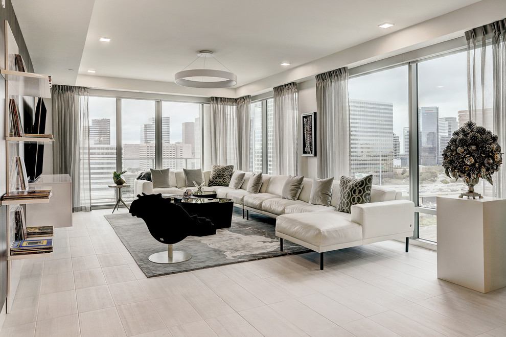 Inspiration for a medium sized contemporary living room in Houston with grey floors and wood walls.