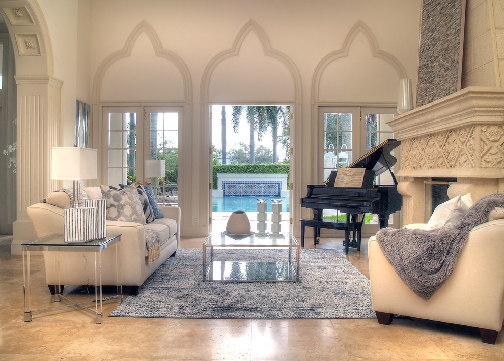 Inspiration for a traditional formal open plan living room in Miami with beige walls, ceramic flooring, a standard fireplace, a concrete fireplace surround and beige floors.