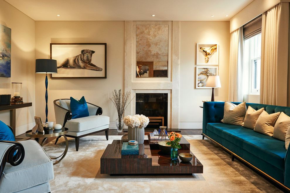 Large contemporary formal living room in London with beige walls and a standard fireplace.