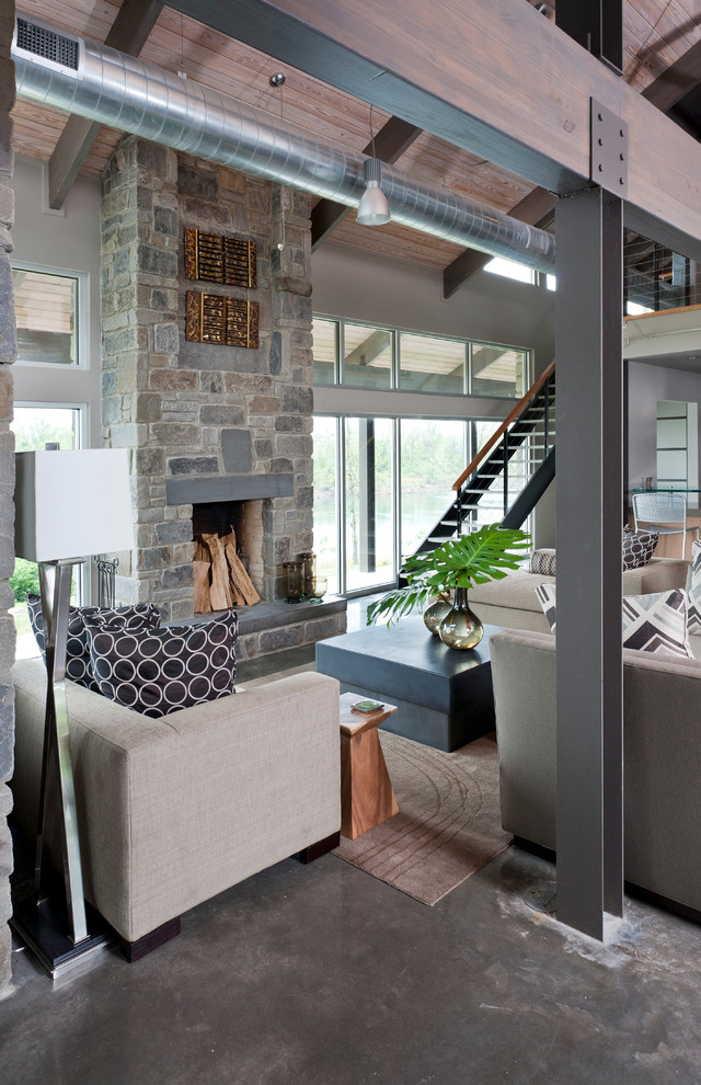 Example of a mid-sized minimalist formal and open concept concrete floor and gray floor living room design in Chicago with gray walls, a standard fireplace, a stone fireplace and no tv