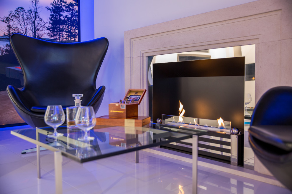 Design ideas for a contemporary living room in Sussex with a ribbon fireplace.