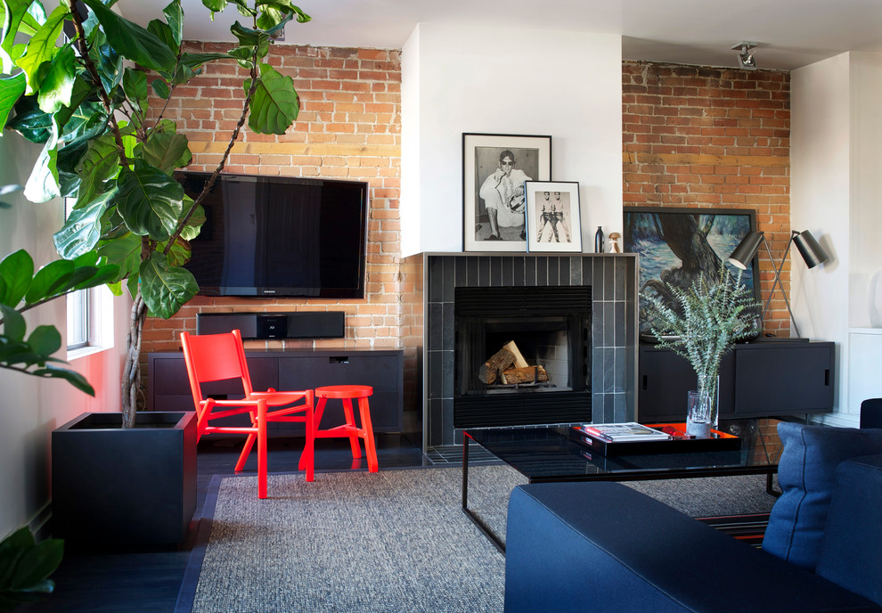 Mid-sized mid-century modern formal and open concept slate floor living room photo in Montreal with white walls, a standard fireplace, a tile fireplace and a wall-mounted tv