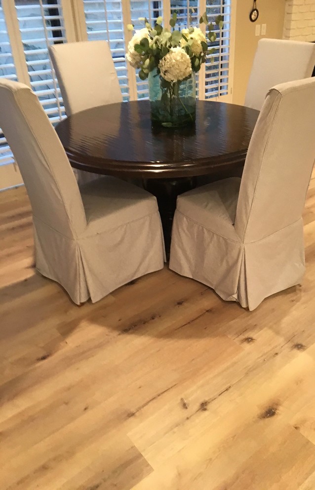 Dining room - traditional vinyl floor and beige floor dining room idea in Orange County