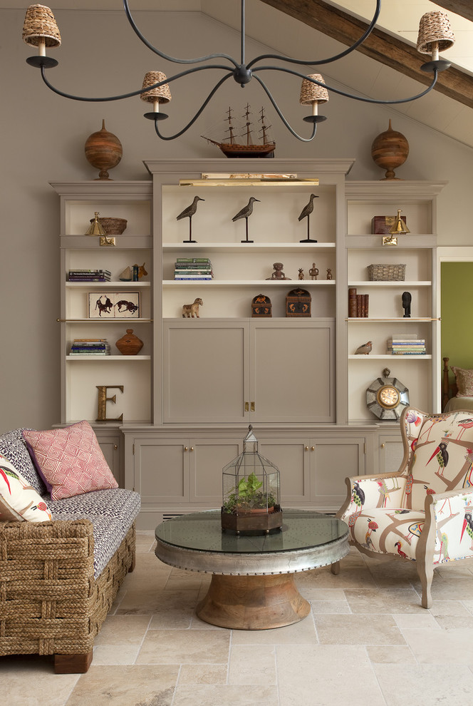Living room - mid-sized mediterranean open concept limestone floor living room idea in New York with gray walls, no fireplace and a concealed tv