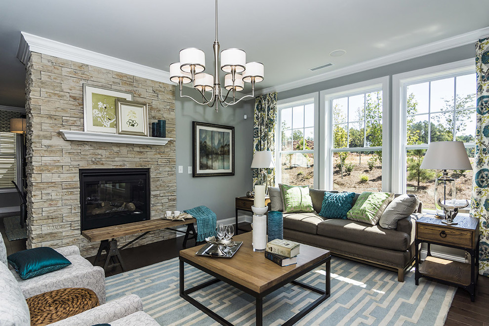 Living room - traditional living room idea in Raleigh with a stone fireplace