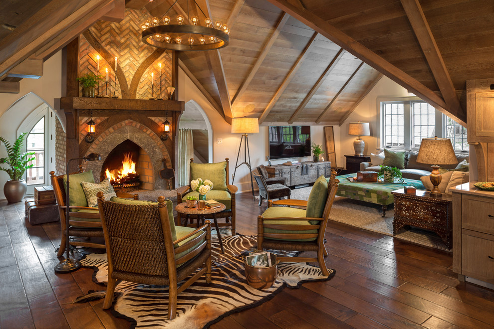 Inspiration for a traditional living room in Milwaukee with beige walls, dark hardwood flooring and a standard fireplace.