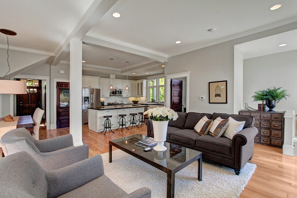Example of a mid-sized ornate open concept and formal light wood floor living room design in Seattle with gray walls, no fireplace and no tv