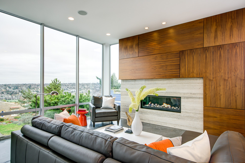 Inspiration for a modern living room in Seattle with concrete flooring.