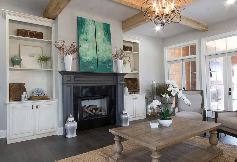 Inspiration for a large transitional dark wood floor living room remodel in New Orleans with gray walls, a standard fireplace and a tile fireplace