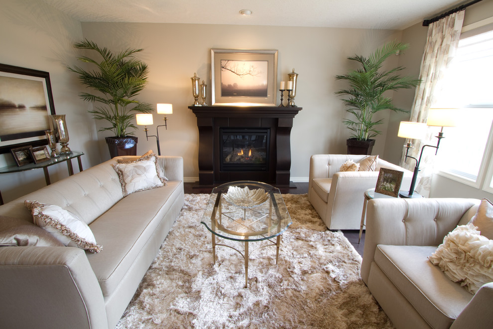 Trendy living room photo in Calgary with gray walls and a standard fireplace