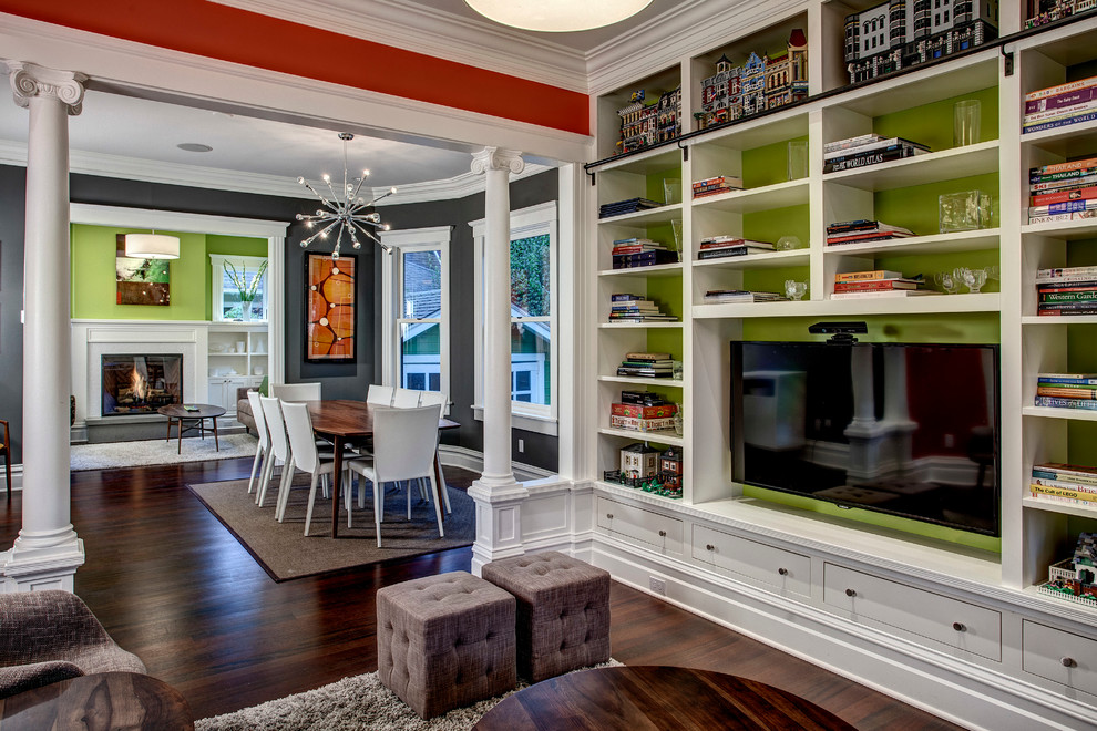 Inspiration for a craftsman living room remodel in Seattle with green walls and a media wall