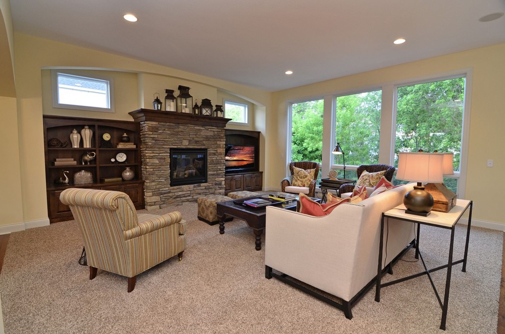 Photo of a traditional living room in Minneapolis with a stone fireplace surround.