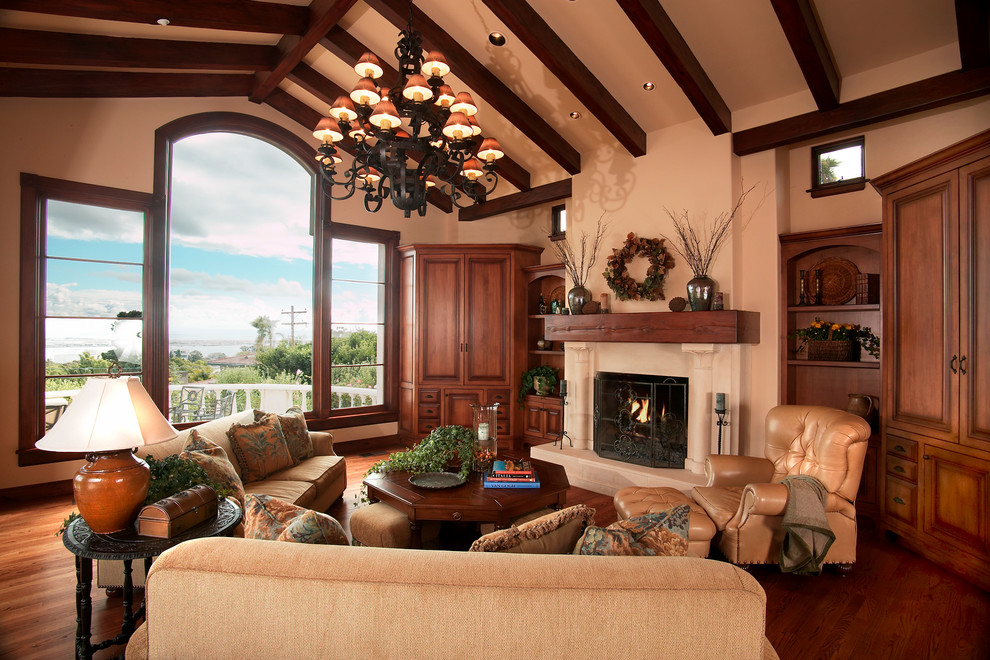 Large tuscan formal medium tone wood floor living room photo in San Diego