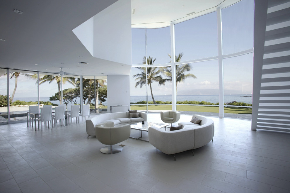 Design ideas for a large modern formal open plan living room in Hawaii with white walls, concrete flooring, no fireplace, no tv and grey floors.