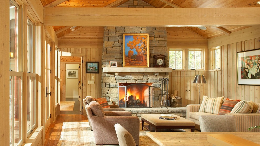 Example of a mid-sized mountain style formal and open concept medium tone wood floor living room design in Other with a standard fireplace and a stone fireplace