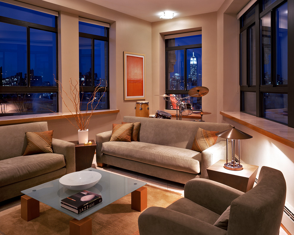 Foto di un soggiorno design con sala della musica e pareti beige