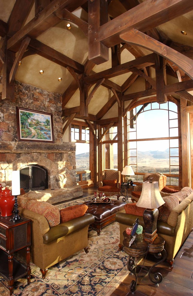 Inspiration for an expansive rustic living room in Salt Lake City with a standard fireplace and a stone fireplace surround.