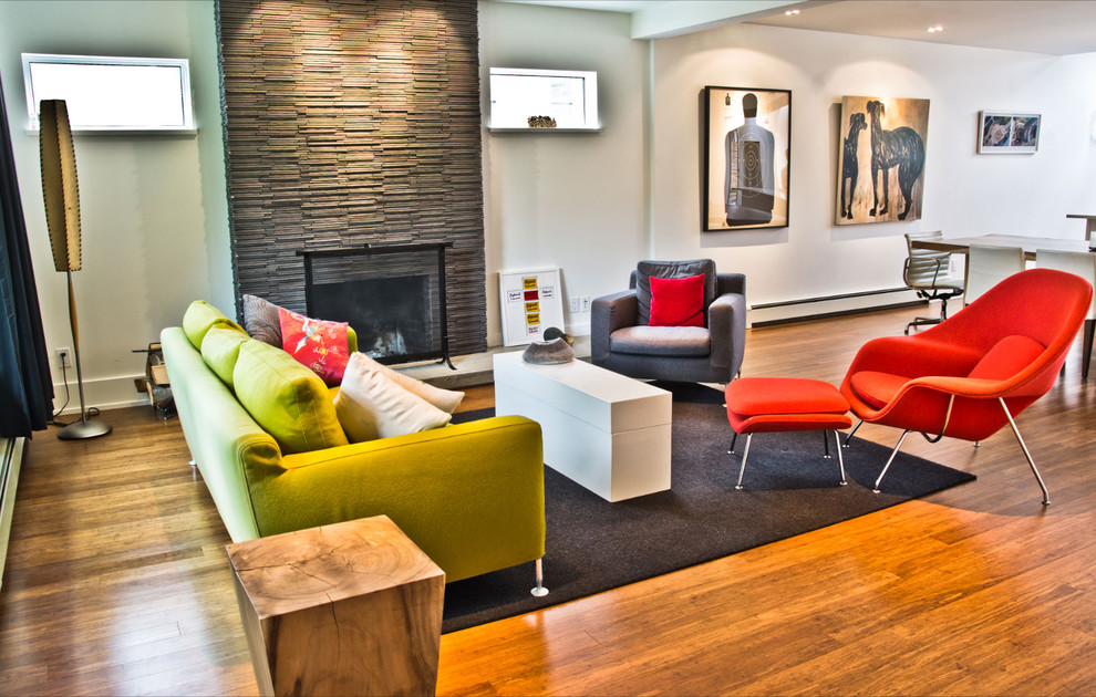 Inspiration for a modern living room remodel in Vancouver with a stone fireplace