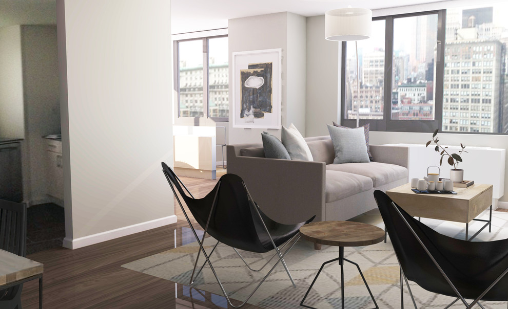 Immagine di un piccolo soggiorno minimalista aperto con angolo bar, pareti grigie, pavimento in legno massello medio, nessun camino e TV autoportante
