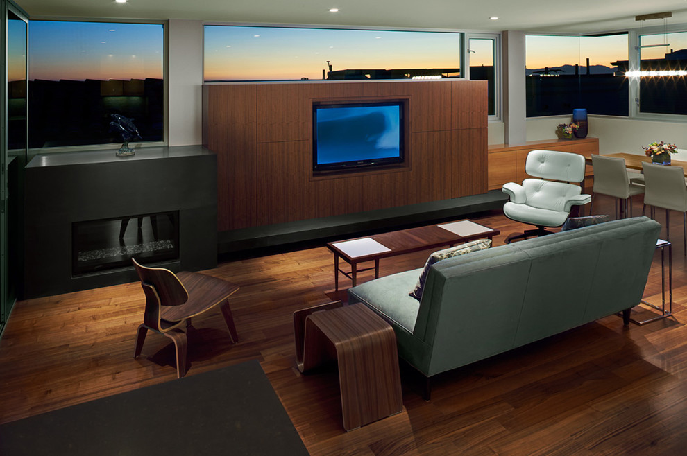 Cette image montre un salon minimaliste avec un téléviseur encastré.