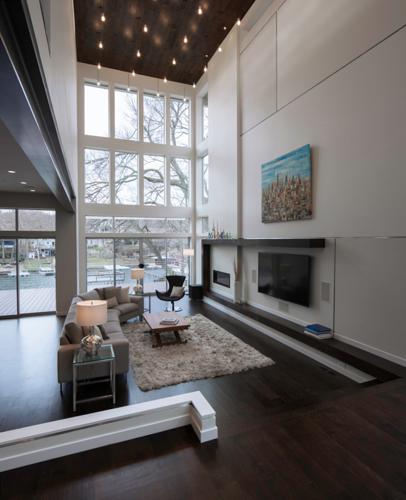 Photo of a large contemporary open plan living room in Kansas City with white walls, dark hardwood flooring, a ribbon fireplace and a wall mounted tv.