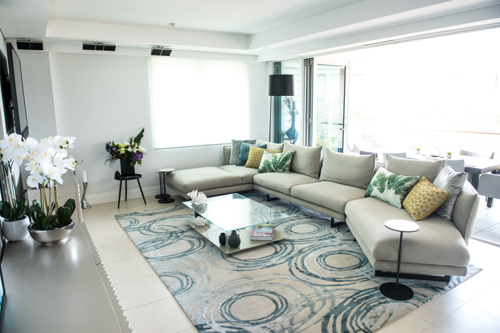 Example of a mid-sized trendy formal and open concept ceramic tile and beige floor living room design in Sydney with white walls, no fireplace and a wall-mounted tv